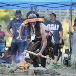 Vallejo, CA — Winnemem Wintu Michael Preston dances before the sacred fire as part of the Run4Salmon opening ceremony at Sogorea Te', a former indigenous village site. September 9, 2017. Tom Levy/The Spiritual Edge